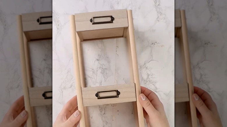 Multi-tier organizer make from wood boxes and dowels