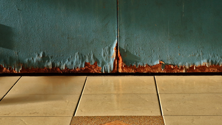 Damaged door with crack underneath