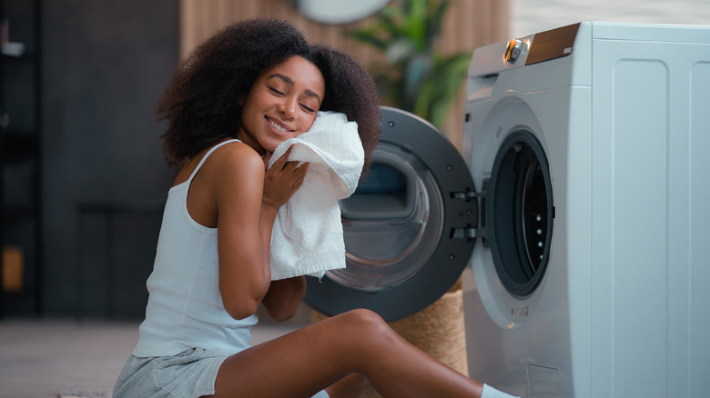 woman hugging towel right out of the dryer