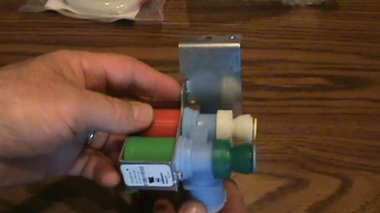 A replacement water inlet valve for a Kenmore refrigerator