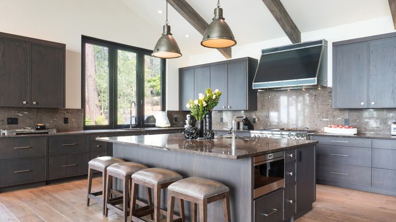 Kitchen island with four bar stools on one side