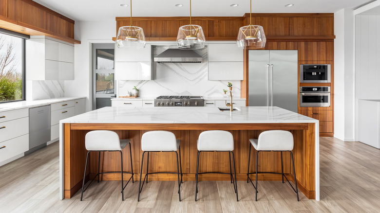 Large kitchen island with warm wood accents