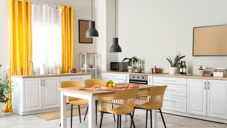 yellow and white curtains in a kitchen window