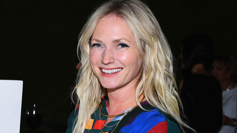 Emily Henderson smiling in multi color shirt