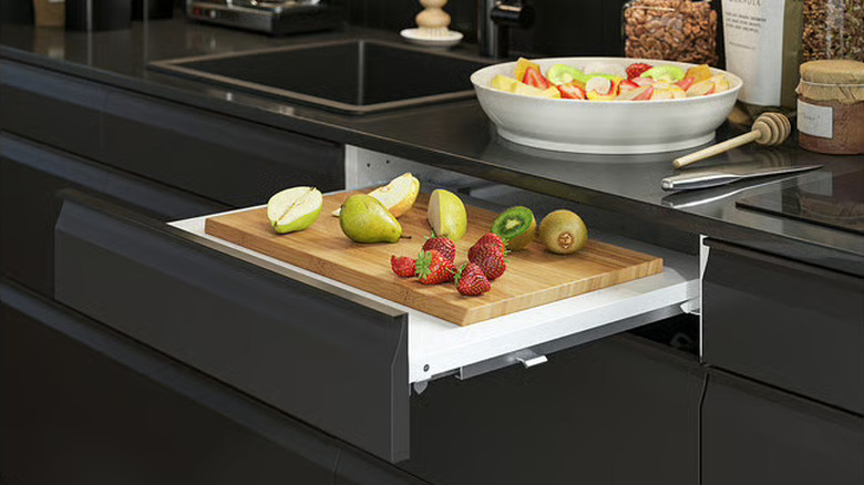 IKEA UTRUSTA pull-out work surface with its own drawer front extended to chop fruit