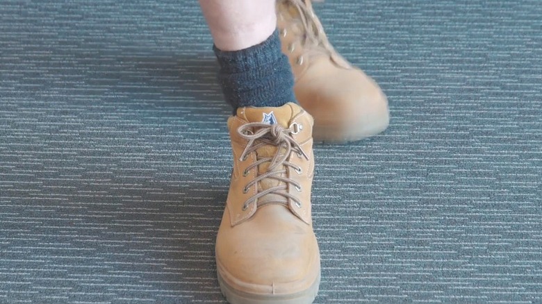 Person walking on textured rubber flooring