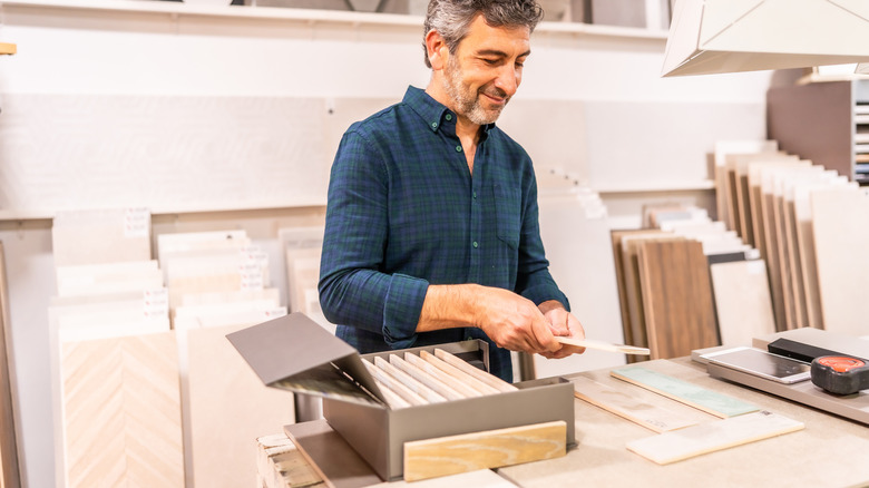 Man selecting flooring for a home renovation