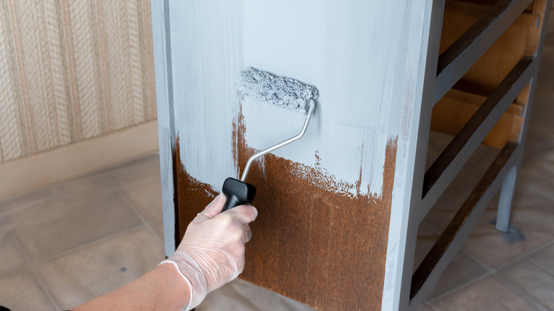 Hand painting a dresser blue