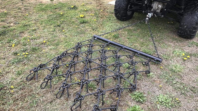 A small version of a traditional chain harrow, towed behind an ATV