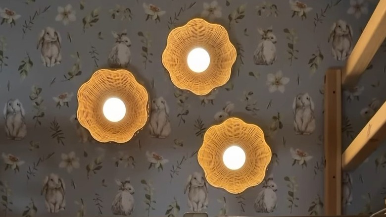 DIY lights made from baskets and puck lights attached to wall