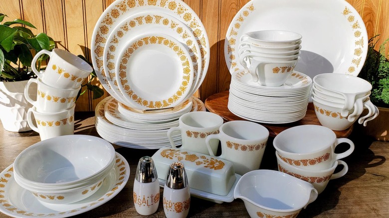 A full dinnerware set with the Corelle Butterfly Gold pattern.