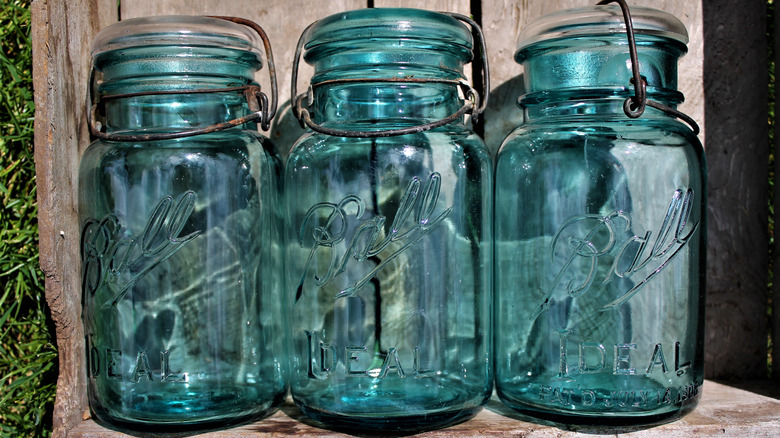 Three aqua blue Ball canning jars