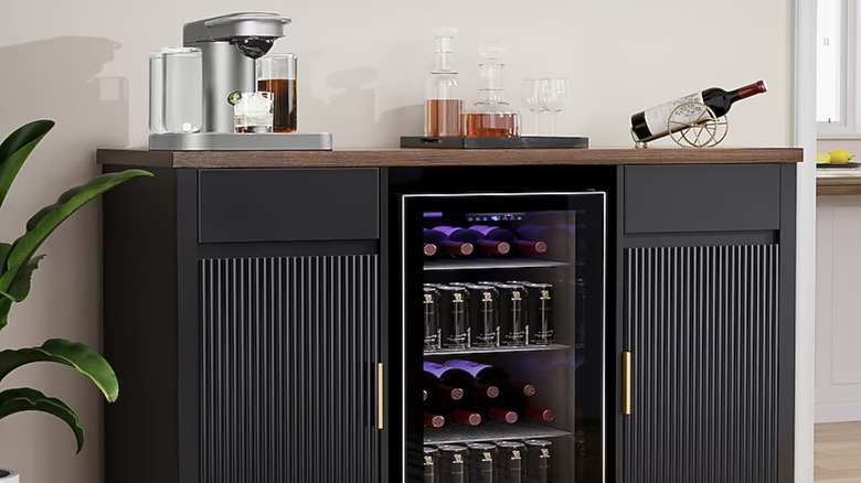 GDLF Large Coffee Bar Cabinet with Fridge Space with a coffee machine, cocktail glasses, a bottle of wine and a nearby indoor plant