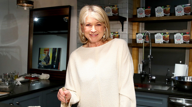 Martha Stewart cooks in a kitchen