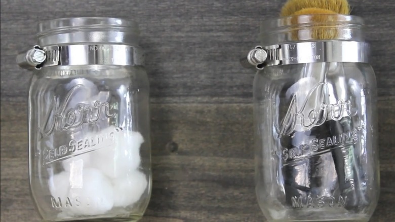 Close up of mason jars mounted to board DIY