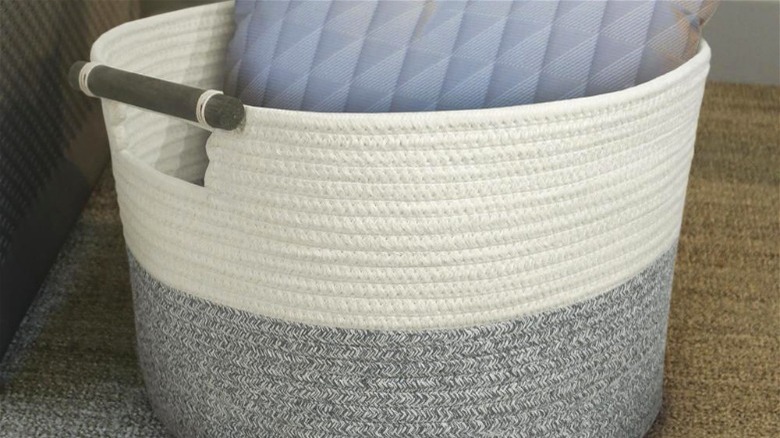 Designer's Image cotton rope storage basket from Menards holding throw pillow