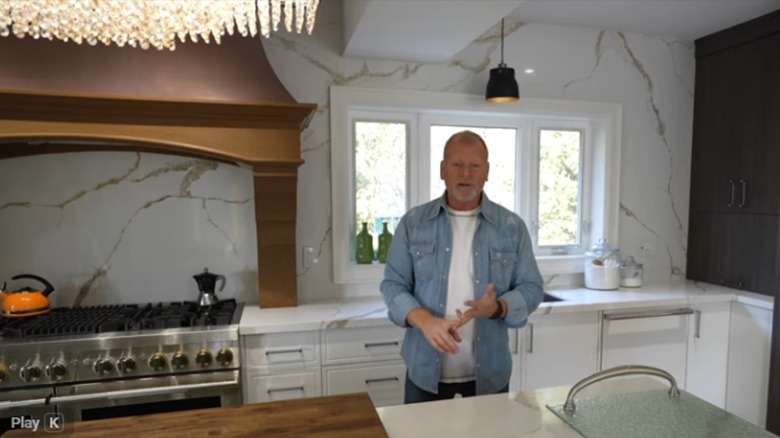 Mike Holmes showcasing a kitchen renovation he completed via his YouTube channel