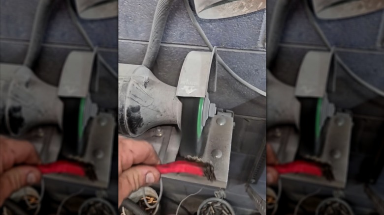 Using a bench grinder to straighten wire brush bristles
