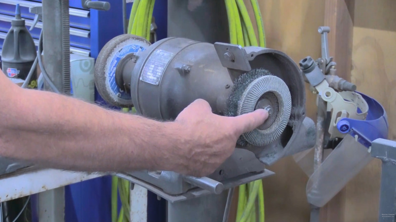 Artist and welder's two-wheel bench grinder side for removing corrosion