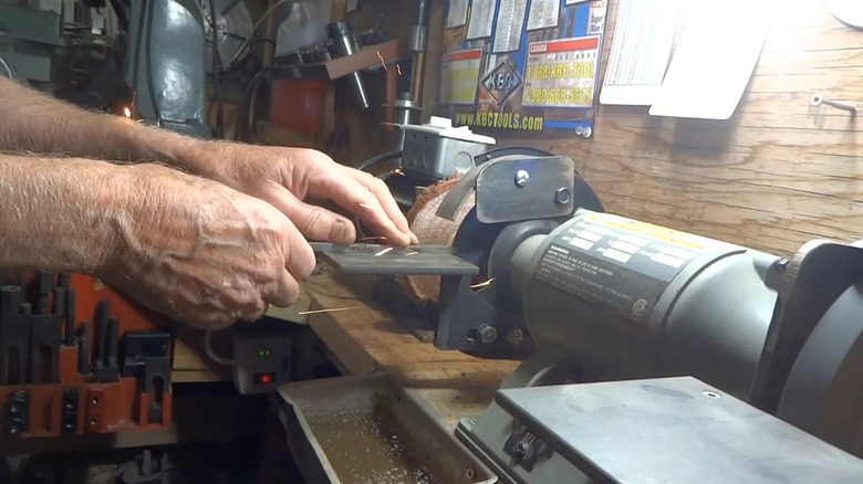 Using a bench grinder customized with a cutoff wheel
