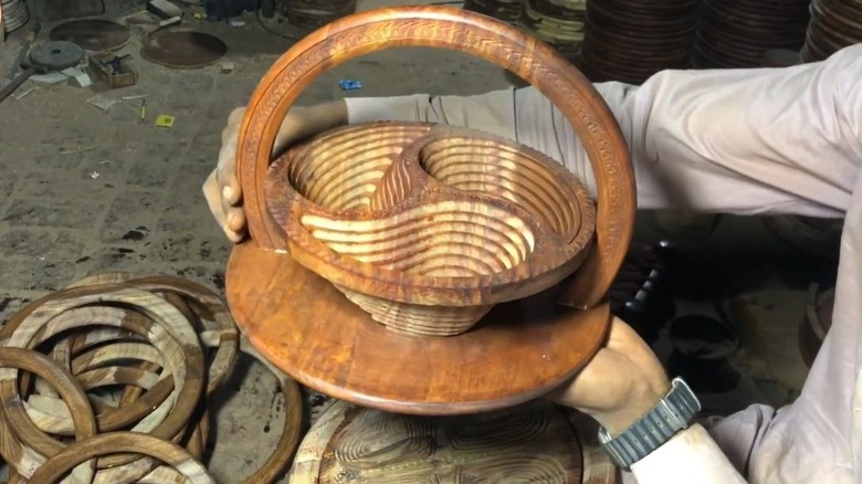 Man holding foldable basket