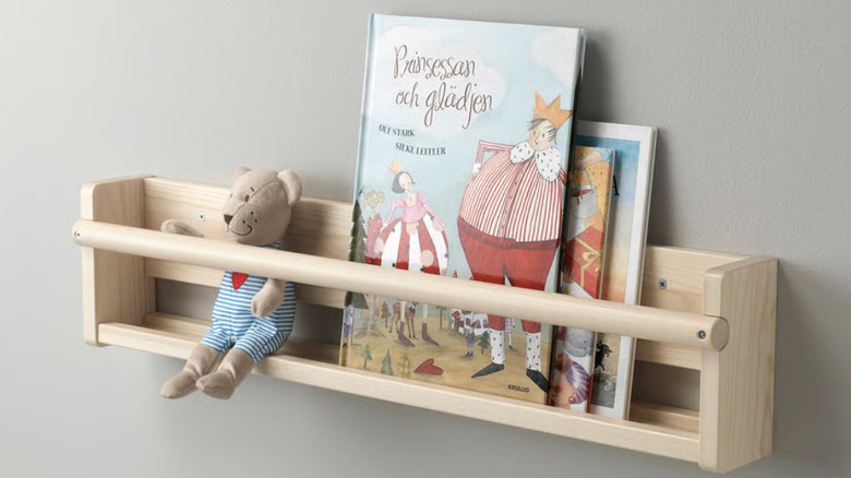 IKEA FLISAT Wall Storage shelf holding books and stuffed bear