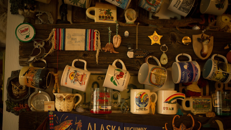 A dense, cluttered display of coffee mugs