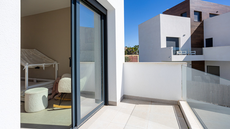 Sliding glass door between a balcony and a child's bedroom