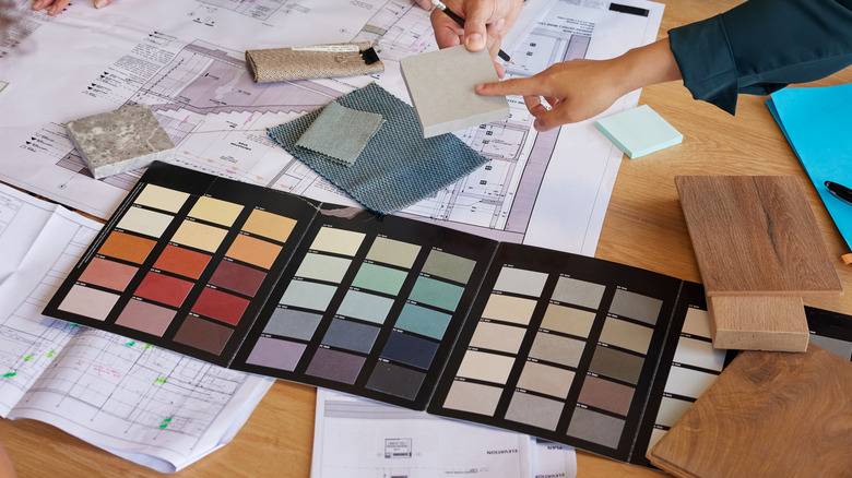 People looking at paint chip samples