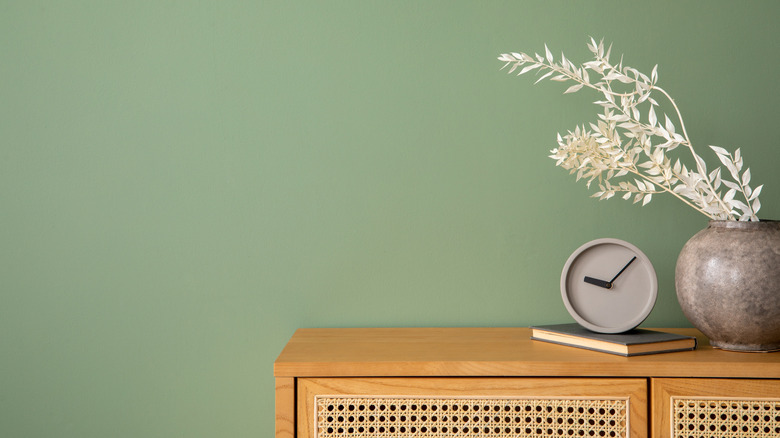 soft green wall color behind nightstand
