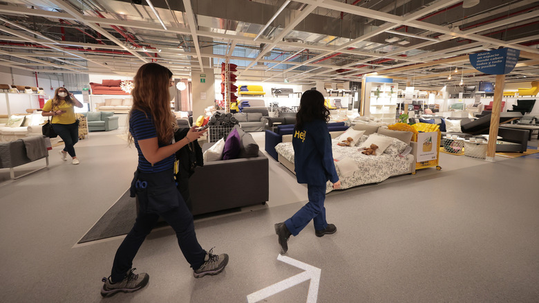 Shoppers walk through IKEA