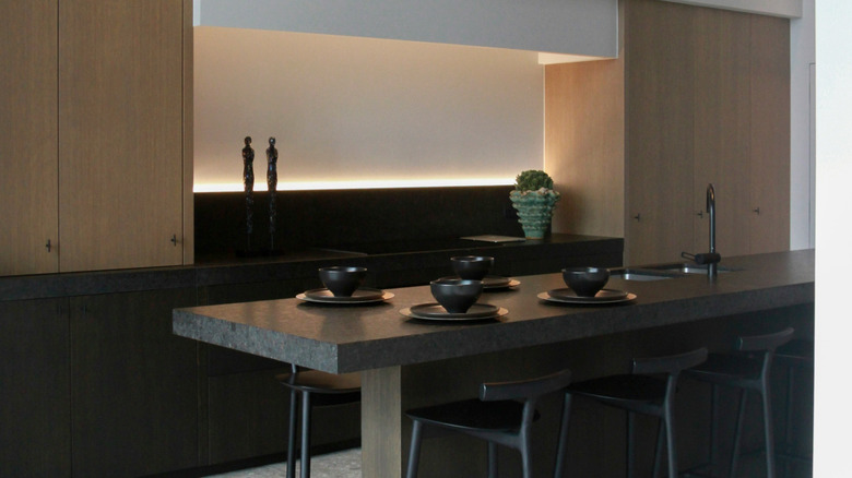 A mostly invisible kitchen integrated into a modern open-floorplan home