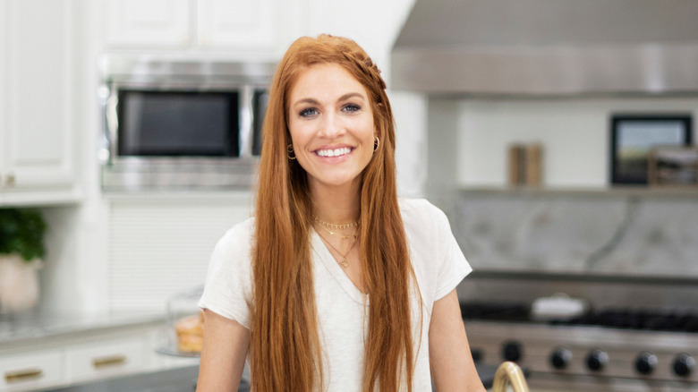 Jenn Todryk smiling in kitchen.
