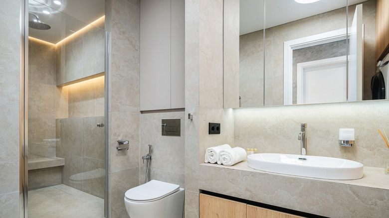 a bathroom with white floors and walls