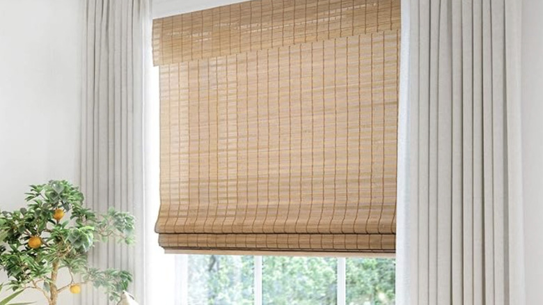 Bamboo roman shades over a large window