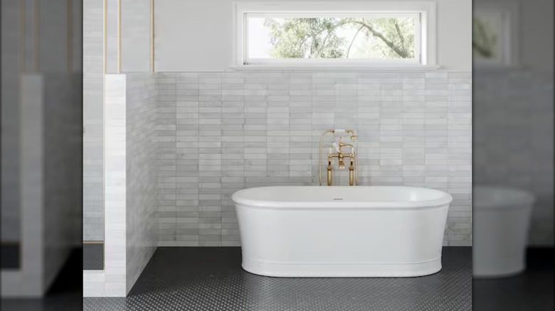 Photo from Home Depot website featuring a Carrara marble tile backsplash in a bathroom
