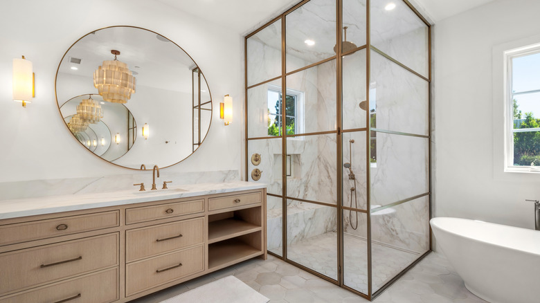 White marble bathroom with a conservatory shower