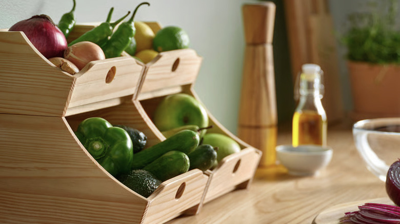 Wooden food storage boxes stacked up on a countertop