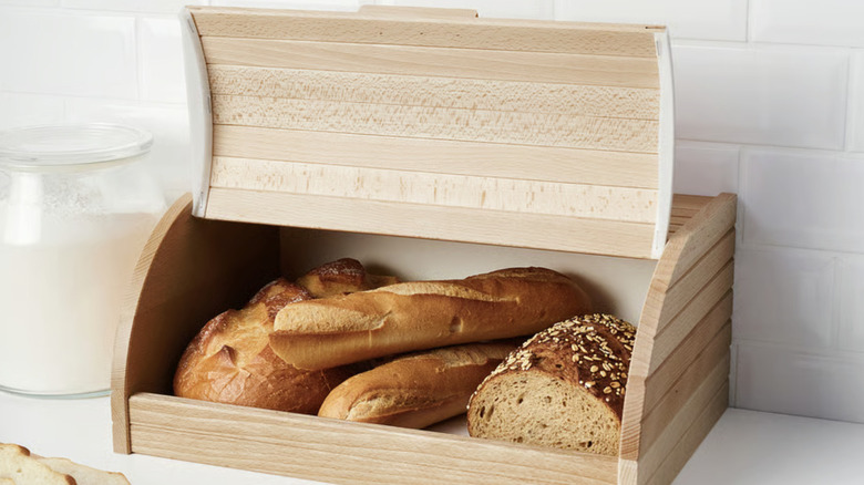Wood bread box with an open lid