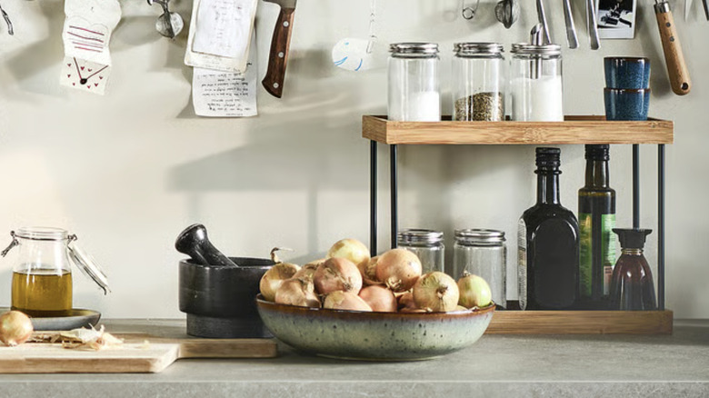 Tiered countertop organizer on a stone surface