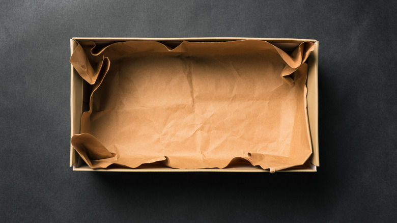Empty shoebox sitting on black background