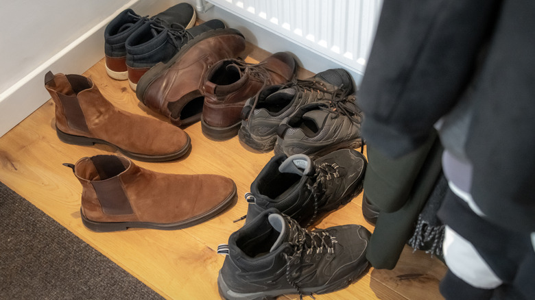 pairs of boots in an entryway