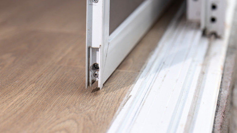 Sliding glass door that has fallen off tracks