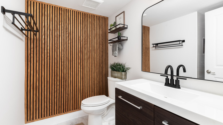 Slatted wood accent wall in bathroom
