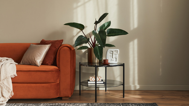 Side table next to an orange sofa