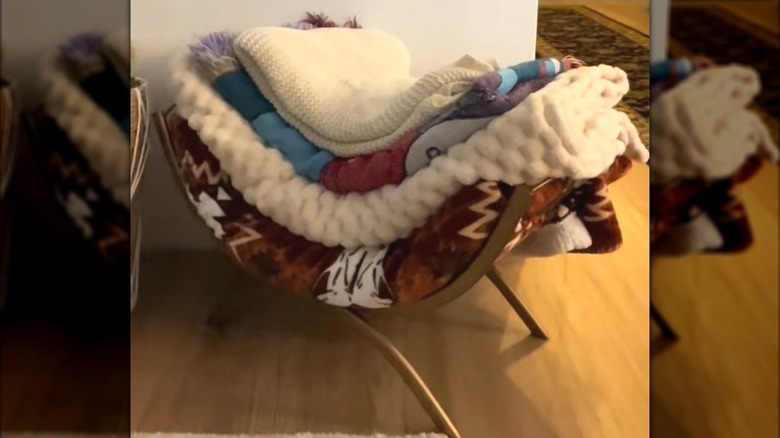 Firewood rack turned into a blanket storage solution