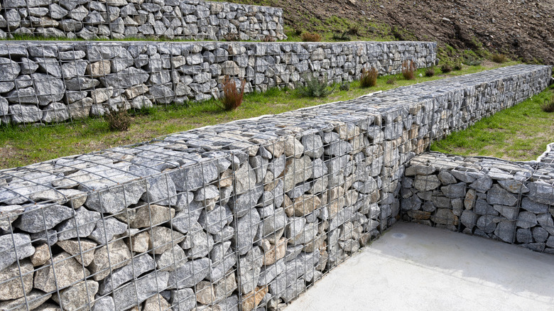 Tiers of gabion walls on steep hill