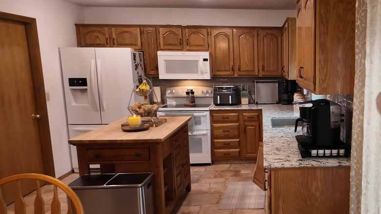 Kitchen with outdated cabinets