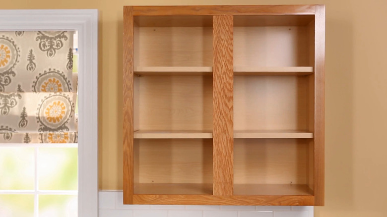 Oak cabinets with the doors removed to create open shelving