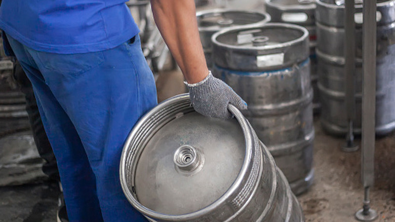 Man carrying beer keg